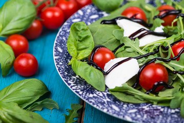 Italian salad with tomatoes,mozzarella, fresh basil and balsamic