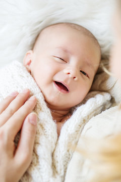 smiling newborn baby