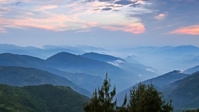 Timelapse of  Foggy Himalayas mountains after sunset. Nepal
