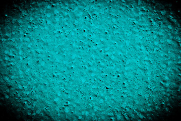 Rusted blue painted metal wall.