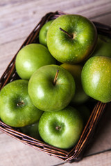 fruit. apples in a basket on wooden table