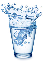 Splash of water in the shape of crown in the glass.