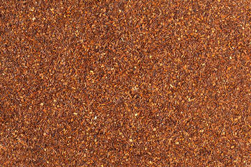 Healthy superfood traditional raw red rooibos tea background