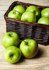 fruit. apples in a basket on wooden table