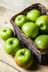 fruit. apples in a basket on wooden table
