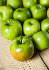 fruit. Ripe green apples on wooden background