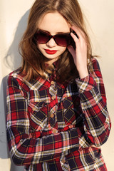Obraz premium fashion shot of a beautiful girl in glasses hipster