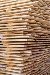 pile of cut wood for construction texture background pattern
