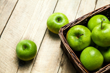fruit. apples in a basket on wooden table