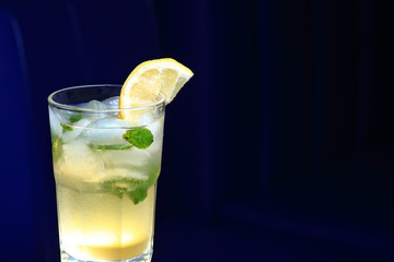 Glass of lemonade with the slice of lemon and mint