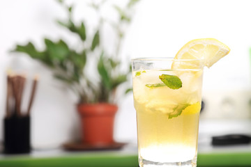 Glass of lemonade with the slice of lemon and mint