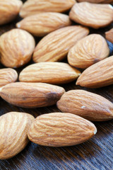 Almonds on wooden background