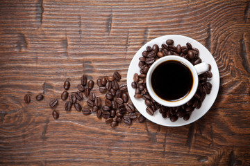 Coffee cup and saucer on wooden table