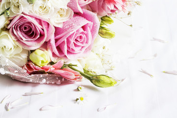 Bouquet on bed in the bedroom