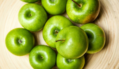 fruit. apples in a bowl on wooden background