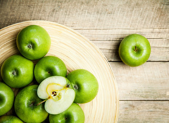 Fototapeta na wymiar fruit. apples in a bowl on wooden background