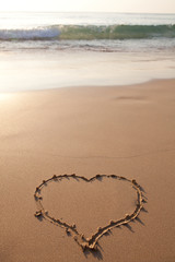 Hearts drawn on the sand of a beach