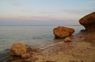 Naklejka na ściany i meble Beautiful seascape. Sea and rock at the sunset. Red sea, Egypt.