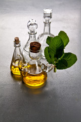 olive oil in a glass bottle. herbs.