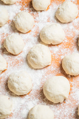 Fototapeta na wymiar dough balls covered with wheat flour 