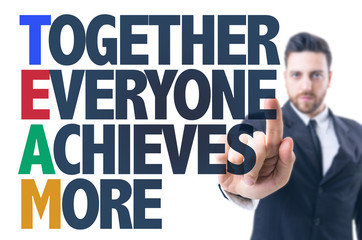 Business man pointing the text: Together Everyone Achieves More