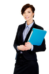 Businesswoman holding a binder.