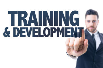 Business man pointing the text: Training & Development
