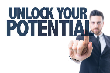 Business man pointing the text: Unlock Your Potential