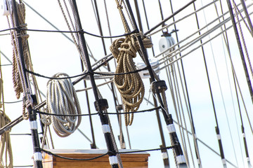 sailboat masts, rigging and rolled up sails