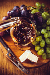 Brandy pours into a glass