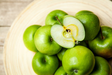 fruit. apples in a bowl on wooden background