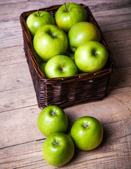 fruit. apples in a basket on wooden table