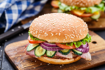 Bacon burger with vegetables and cutlet