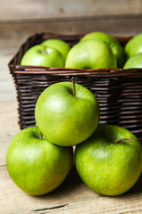fruit. apples in a basket on wooden table