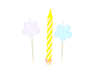 three colored Candles on white