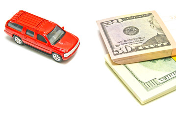 single red car and dollar notes on white
