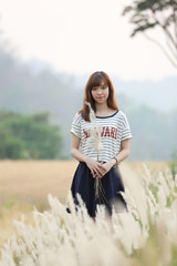 Young woman in wheat