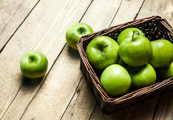 fruit. apples in a basket on wooden table