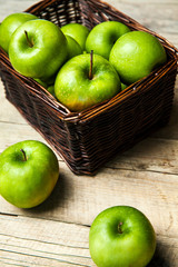 fruit. apples in a basket on wooden table