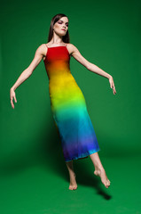 Young beautiful female model in colorful dress