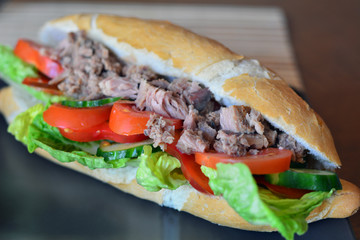 Tuna Baguette With Vegetables On The Brown Plate