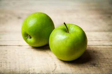 fruit. green apples on wooden background