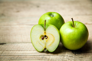 fruit. green apples on wooden background