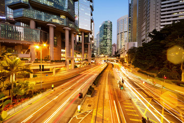 Fototapeta na wymiar traffic light trails and office buildings in modern city