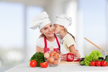 Mother. Mother and daughter prepare salads