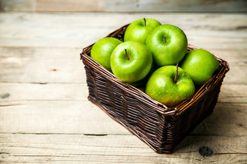 fruit. apples in a basket on wooden table