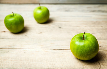 fruit. green apples on wooden background