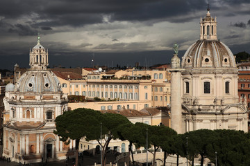 Fototapeta na wymiar Trajan Column and Baroque churches in Rome, Italy.