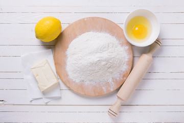Ingredients for dough on wooden board