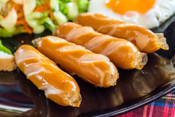 closeup plate of sausages on the table